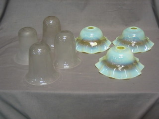 3 circular vaseline glass light shades 7" and 4 opaque bell shaped glass light shades 5"