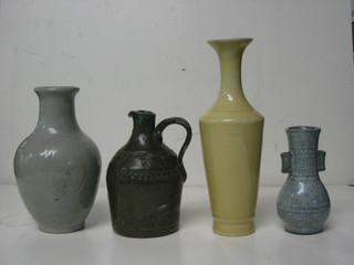 An Oriental white glazed vase 7", an Oriental yellow club shaped vase 10", an Art Pottery flask 7" and a club shaped crackle glazed vase 5"