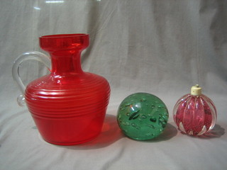 A red Art Glass jug with clear glass handle 10", a large blue bottle glass paperweight 4" and a glass lamp base