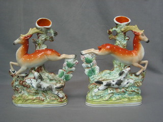 A pair of 19th Century Staffordshire spill vases in the form of stags with dogs 11 1/2" (1f)
