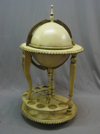 A cocktail cabinet in the form of a Globe, raised on a stand with gadrooned decoration 23"