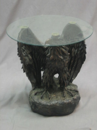 A  bronzed occasional  table in the form of an eagle with outstretched wings, having a circular plate glass top, 18"