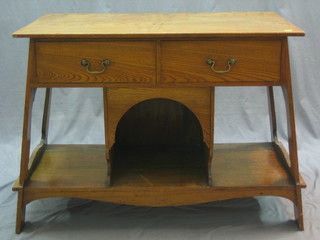 An Art Nouveau oak wash stand fitted 2 long drawers above a recess 38"