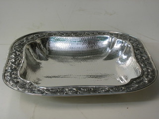A square embossed planished silver plated bowl, raised on 4 bun feet 15 1/2"