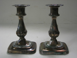 A pair of 19th Century silver plated candlesticks 7"