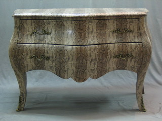 A bombe shaped commode of serpentine outline, fitted 2 drawers, raised on cabriole supports, covered in simulated snake skin 48"