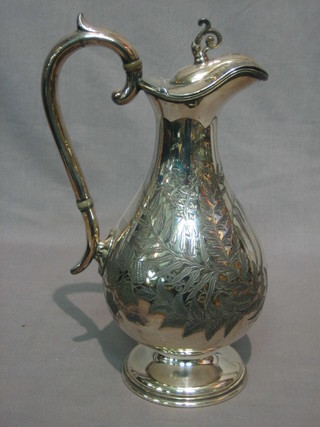 A Victorian engraved Britannia metal hotwater jug