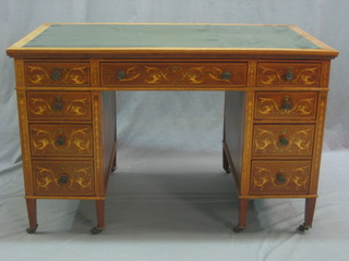 An Edwardian inlaid mahogany desk with inset writing surface above 1 long and 8 short drawers, raised on square tapering supports 45"