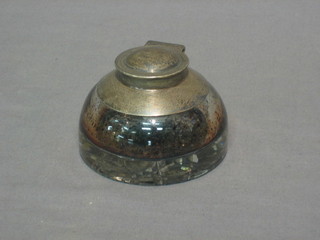 A circular cut glass inkwell with silver mounts (marks rubbed) 3 1/2"