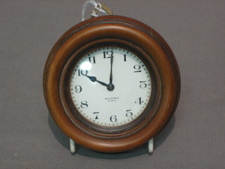 A Waltham 8 day car clock contained in a mahogany case