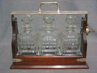 A silver plated and mahogany 3 bottle tantalus