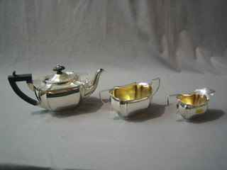 A shaped 3 piece silver plated tea service comprising teapot, twin handled sugar bowl and cream jug