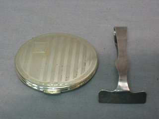 A childs silver pusher, Birmingham 1932 and a Kigu silver plated compact