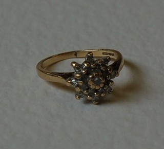 A lady's 9ct gold cluster ring set numerous diamonds