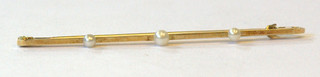 A 15ct gold bar brooch set 3 demi-pearls