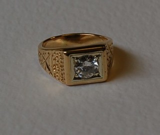 A gentleman's gold signet ring set a solitaire diamond, approx 1.5cts