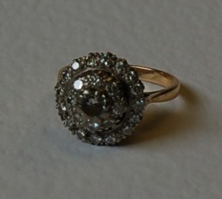 A lady's 18ct gold cluster dress ring set numerous diamonds