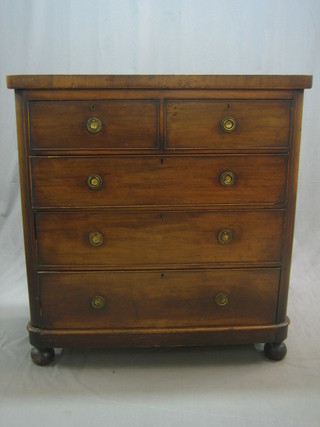 A Victorian mahogany D shaped chest of 2 short and 3 long drawers, raised on bun feet 40"