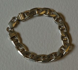 A modern silver flat link bracelet