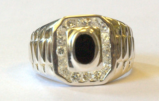 A gentleman's large silver signet ring set a blue hardstone
