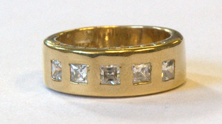 A 14ct gold dress ring set 5 square cut white stones