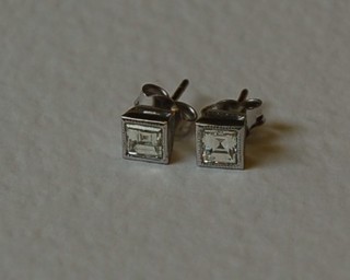 A pair of square cut diamond stud earrings, approx 0.90ct