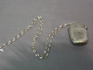 A Victorian oval engraved silver vesta case, Birmingham 1897 hung on a fine chain