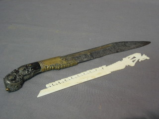 An Eastern dagger with horn handle 12" and a carved ivory paper knife