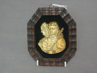 A carved ivory portrait profile bust of Isabella and Ferdinand 2" x 2"