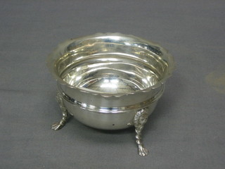 A circular silver sugar bowl raised on 3 hoof supports, marks rubbed, 4 ozs
