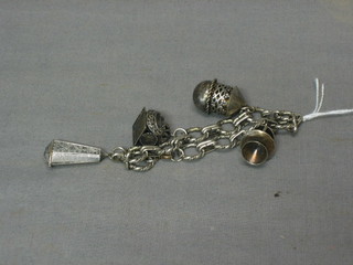 A silver charm bracelet hung 4 charms