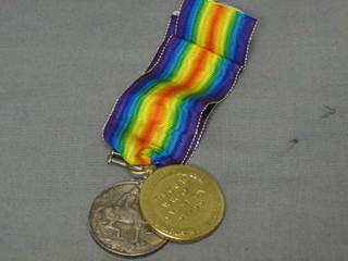 A  pair to 201211 Pte. A H Carnell East Surrey Regt with British War medal and Victory medal