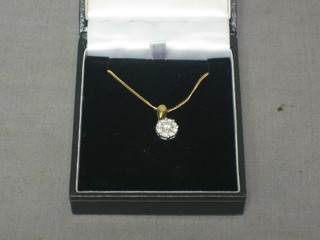 An 18ct gold floral cluster pendant set numerous diamonds