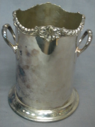 A silver plated soda siphon holder