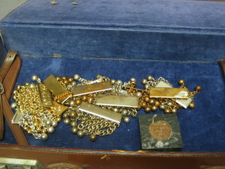 A Masonic attache case containing various apron tassels and 2 Rotary Club pins