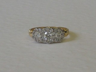 A lady's 18ct yellow gold triple cluster ring set numerous diamonds approx 0.69ct