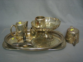 A 4 piece silver plated hotelware tea service with teapot, hotwater jug, twin handled sugar bowl and milk jug, 2 silver plated trays, a match slip and a silver backed handmirror