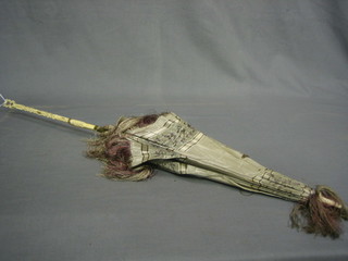 A parasol with turned ivory handle