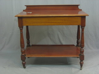 An Edwardian inlaid mahogany side table with raised back, fitted a drawer above undertier 38"
