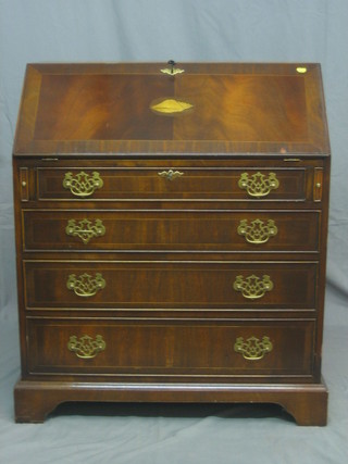 A Georgian style inlaid mahogany bureau with well fitted interior above 4 long graduated drawers, raised on bracket feet 32"