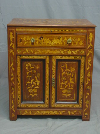 An 18th/19th Century Dutch inlaid marquetry commode fitted a drawer above double cupboard enclosed by panelled doors 25" (possibly reduced in height)