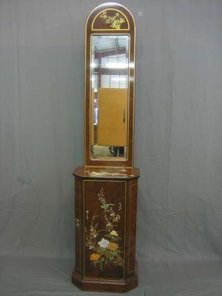 An Eastern brown lacquered cabinet, the upper section fitted a rectangular plate mirror 17"