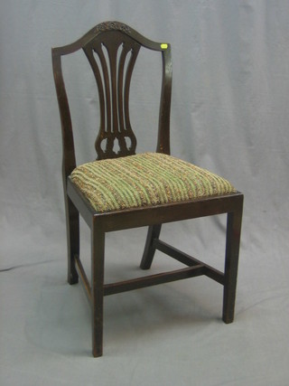 A 19th Century mahogany Hepplewhite style camel back chair with upholstered drop in seat, raised on square tapering supports