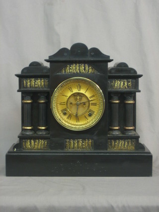 An American 8 day mantel clock with visible escapement, paper dial and Roman numerals contained in an architectural cast iron case