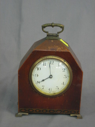 A French 8 day bedroom timepiece with enamelled dial and Arabic numerals contained in a mahogany "lancet" shaped case