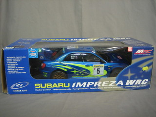 An MRC Subaru Impreza WRC model radio controlled racing car, 1.10 scale with 2 speeds, 