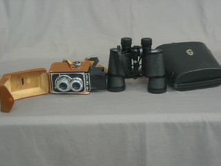 A pair of Hans Weiss 16 x 50 binoculars together with Halina A1 camera