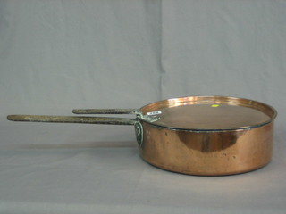 A 19th Century copper saucepan with iron handle 13"
