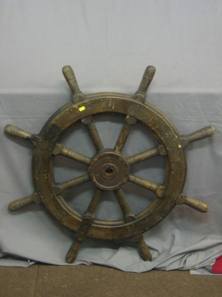 A reproduction 8 spoked ships wheel 27"
