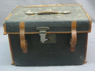 A fibre and leather case with hinged lid, by the Arm & Navy Co-operative Society (hinge f) containing 2 tunic shirts